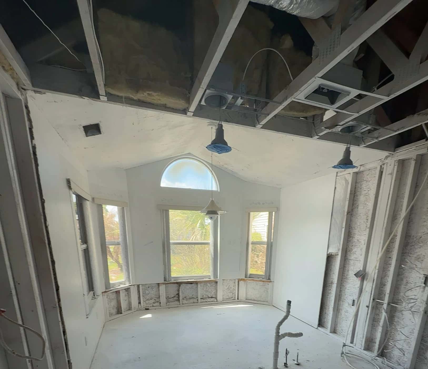 Exposed framing during Shawn’s fire restoration work.