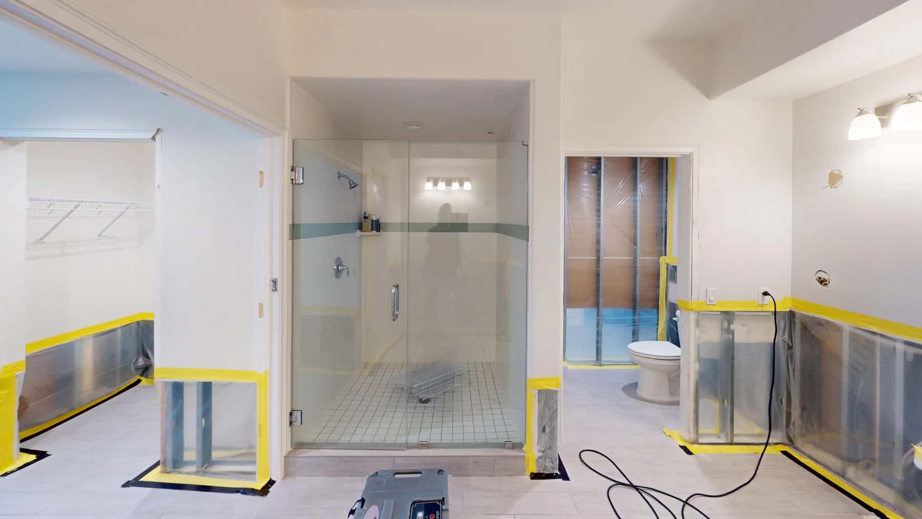 Containment barriers and opened lower walls during mold remediation.
